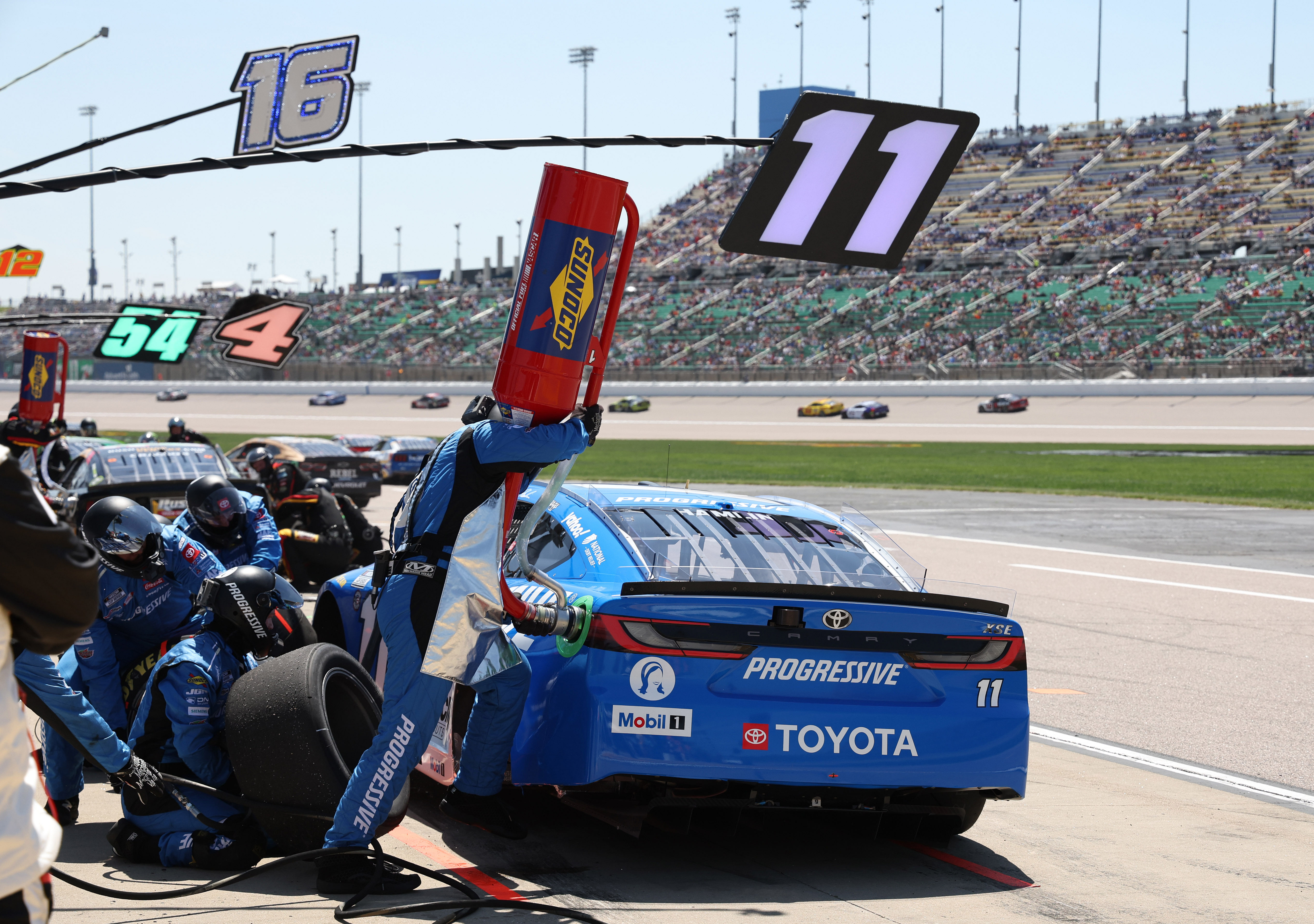 Denny Hamlin (11) stops for fuel and tires early in the AdventHealth 400. Source: Imagn
